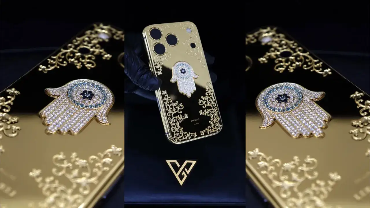 Złoty iPhone 6 z motywem dłoni Fatimy, ozdobiony diamentami i różowymi kamieniami, niczym falcon supernova.